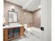 Tastefully-designed bathroom features modern fixtures, stylish tile, and plenty of natural light at 1490 S Vine St, Denver, CO 80210
