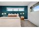 Cozy bedroom featuring a large window, stylish lamps, and neutral tones for a peaceful ambiance at 1490 S Vine St, Denver, CO 80210
