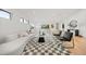 Open living room featuring hardwood floors, modern furniture, and ample natural light at 1490 S Vine St, Denver, CO 80210