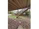 Under-deck patio featuring gravel, stairs, and access to fenced backyard with lawn at 10475 Applebrook Cir, Highlands Ranch, CO 80130