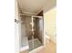 Modern bathroom featuring a glass-enclosed shower, built-in seat, and tiled walls for a spa-like experience at 10475 Applebrook Cir, Highlands Ranch, CO 80130