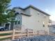 View of home's exterior showing stone accents and three car garage at 10475 Applebrook Cir, Highlands Ranch, CO 80130