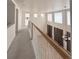 Upstairs hallway overlooking living area with high ceilings and lots of natural light at 10475 Applebrook Cir, Highlands Ranch, CO 80130
