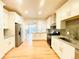 Modern kitchen with stainless steel appliances, and breakfast bar island at 10475 Applebrook Cir, Highlands Ranch, CO 80130