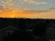Scenic sunset view overlooking the city and mountains from the rooftop at 10475 Applebrook Cir, Highlands Ranch, CO 80130