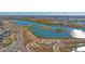 Aerial view of a community lake with walking trails, green spaces, and scenic views at 4316 Gypsum Ave, Mead, CO 80504