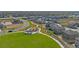 Aerial view of a neighborhood featuring a playground, park, and walking trails surrounded by well-maintained homes at 4316 Gypsum Ave, Mead, CO 80504