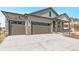 Beautiful home exterior showcasing a stone facade and a wide driveway at 4316 Gypsum Ave, Mead, CO 80504