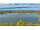 Scenic view of a lake surrounded by farmland and the Rocky Mountains at 4316 Gypsum Ave, Mead, CO 80504