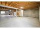 Spacious unfinished basement with concrete floor and exposed wood ceiling at 2120 Gross Dam Rd, Golden, CO 80403