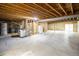 Unfinished basement features cement floors and block wall, and exposed ceiling at 2120 Gross Dam Rd, Golden, CO 80403