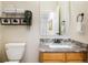 This bathroom features a single vanity, granite countertop, and decorative wall shelving at 2120 Gross Dam Rd, Golden, CO 80403