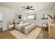 Bright bedroom featuring a wooden bed frame, ceiling fan, and natural light from the window at 2120 Gross Dam Rd, Golden, CO 80403