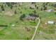 Expansive property featuring lush greenery and mature trees, set against a serene, natural backdrop at 34586 Morgan Trl, Elizabeth, CO 80107
