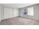 Bedroom with carpeting, natural light from window, and closet space at 34586 Morgan Trl, Elizabeth, CO 80107