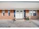 Covered front porch with double doors, sidelights, and brick facade at 34586 Morgan Trl, Elizabeth, CO 80107
