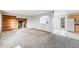 Open-concept living room with a brick fireplace and adjacent kitchen area at 34586 Morgan Trl, Elizabeth, CO 80107