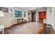 Living room with wood floors, bay windows, basket and vintage furniture at 34586 Morgan Trl, Elizabeth, CO 80107