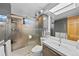 Modern bathroom featuring walk-in shower, integrated lighting and sleek fixtures at 812 Aspen Rd, Golden, CO 80401