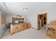 Bedroom featuring rustic wood furniture and a private closet with ample space for storage at 812 Aspen Rd, Golden, CO 80401