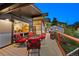Inviting deck area with comfortable seating, offering a serene outdoor space with views of the surrounding greenery and guest house at 812 Aspen Rd, Golden, CO 80401