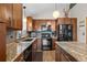 Stylish kitchen with stainless appliances, sleek countertops, and wood cabinetry at 812 Aspen Rd, Golden, CO 80401