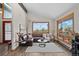 Living room featuring a comfortable sofa, large windows, and views of the outdoors at 812 Aspen Rd, Golden, CO 80401