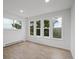 Sun-filled room with multiple windows offering beautiful views of the forest at 13910 Blue Jay Ln, Larkspur, CO 80118