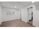 Bright bedroom with plank flooring, a large window and neutral decor at 13910 Blue Jay Ln, Larkspur, CO 80118