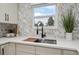 Modern kitchen featuring an apron sink, sleek countertops, and a stylish faucet at 13910 Blue Jay Ln, Larkspur, CO 80118