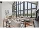Bright living room with large windows and modern furniture at 13910 Blue Jay Ln, Larkspur, CO 80118