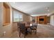 Well-lit basement space offering a dining area with access to the fireplace and media center at 22023 E Heritage Pkwy, Aurora, CO 80016