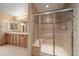 Bathroom with tiled shower, and tile floors, a large mirror, and double sinks at 22023 E Heritage Pkwy, Aurora, CO 80016
