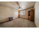 Spacious bedroom featuring neutral carpet, a ceiling fan and a window with bright natural light at 22023 E Heritage Pkwy, Aurora, CO 80016