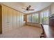 Neutral bedroom with built in storage, carpeted floors, and natural light from the windows at 22023 E Heritage Pkwy, Aurora, CO 80016