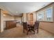 Basement dining area featuring a wooden bar and seating space with great natural light at 22023 E Heritage Pkwy, Aurora, CO 80016