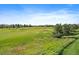 Scenic view of the community golf course, a stunning feature of this amazing property at 22023 E Heritage Pkwy, Aurora, CO 80016