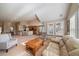 Open-concept living room seamlessly connects to a kitchen and dining area with large windows for natural light at 22023 E Heritage Pkwy, Aurora, CO 80016