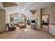 Inviting living room features vaulted ceilings, fireplace, large windows, and comfortable seating arrangements at 22023 E Heritage Pkwy, Aurora, CO 80016