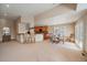 Open-concept living room seamlessly connects to a kitchen and dining area creating a harmonious and inviting space at 22023 E Heritage Pkwy, Aurora, CO 80016