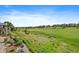 Expansive view of the neighborhood and lush green golf course surrounding this stunning property at 22023 E Heritage Pkwy, Aurora, CO 80016
