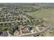 Scenic aerial view of neighborhood showcasing a two-story home with a three-car garage and landscaped yard at 5181 Appleton Way, Castle Rock, CO 80104