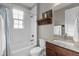 Bathroom with tiled shower/tub, granite vanity and decorative wood shelf at 5181 Appleton Way, Castle Rock, CO 80104