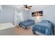Inviting bedroom with two beds, a window, and soft blue decor accents at 5181 Appleton Way, Castle Rock, CO 80104
