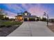 Charming two-story home with inviting porch, landscaped yard, and a three-car garage plus a separate one car garage at 5181 Appleton Way, Castle Rock, CO 80104