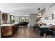 Open-concept kitchen with an island and modern appliances, connected to the living area at 5181 Appleton Way, Castle Rock, CO 80104