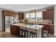 Gourmet kitchen boasting granite countertops, stainless steel appliances, and a spacious central island at 5181 Appleton Way, Castle Rock, CO 80104