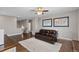 Comfortable living area with hardwood floors, a plush rug, ceiling fan and unique decor at 5181 Appleton Way, Castle Rock, CO 80104