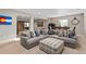 Relaxing living room with a comfortable sectional sofa and unique ottoman, perfect for Gathering gatherings at 5181 Appleton Way, Castle Rock, CO 80104
