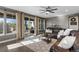 Cozy living room with a sliding door and large windows offering a serene view and ample natural light at 5181 Appleton Way, Castle Rock, CO 80104